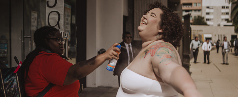 Morgan spraying Chaya with Sunscreen
